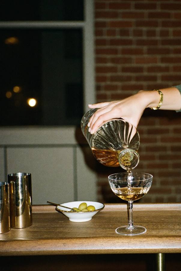 A guest pouring their own drink